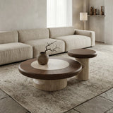 Walnut round coffee table set with large and small tables, warm wood tops and sculptural stone bases arranged on a neutral rug