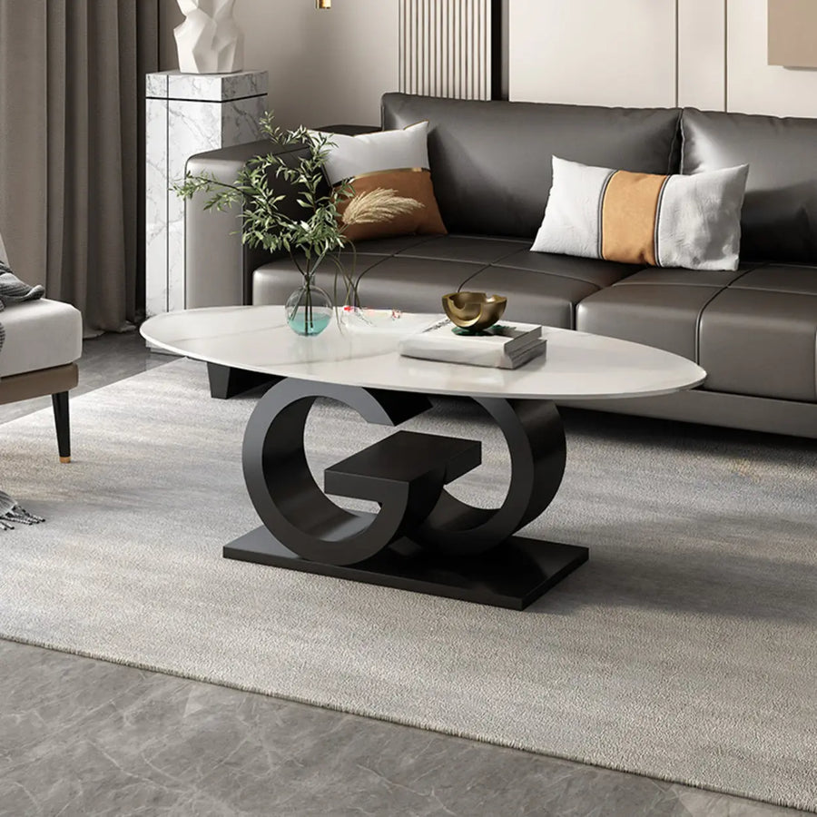 White oval stone coffee table with dark steel base in a modern living room